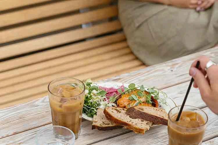Healthy wellness bar snack with a latte on wooden table