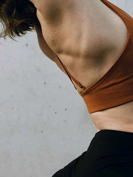 women stretching leaning back